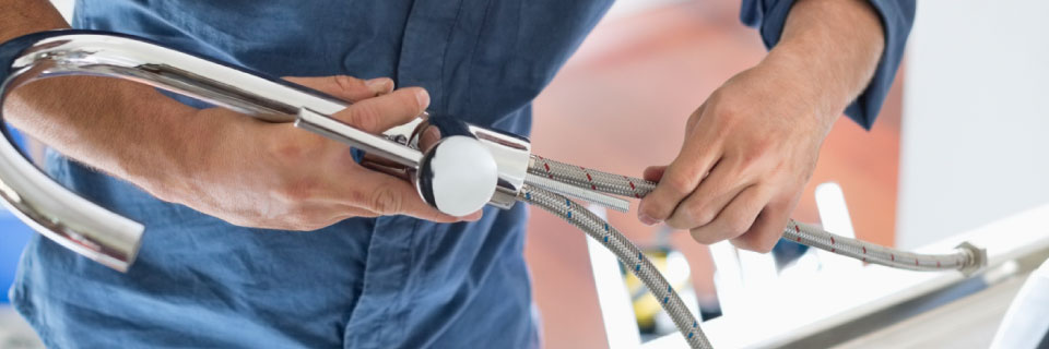 Plumber fixing sink